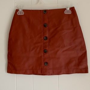 Bert Orange size small mini skirt with buttons in the front